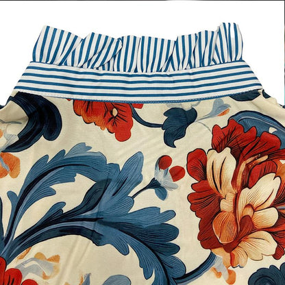 Baroque Floral Satin Blouse – Bold Print with Striped Ruffle Details